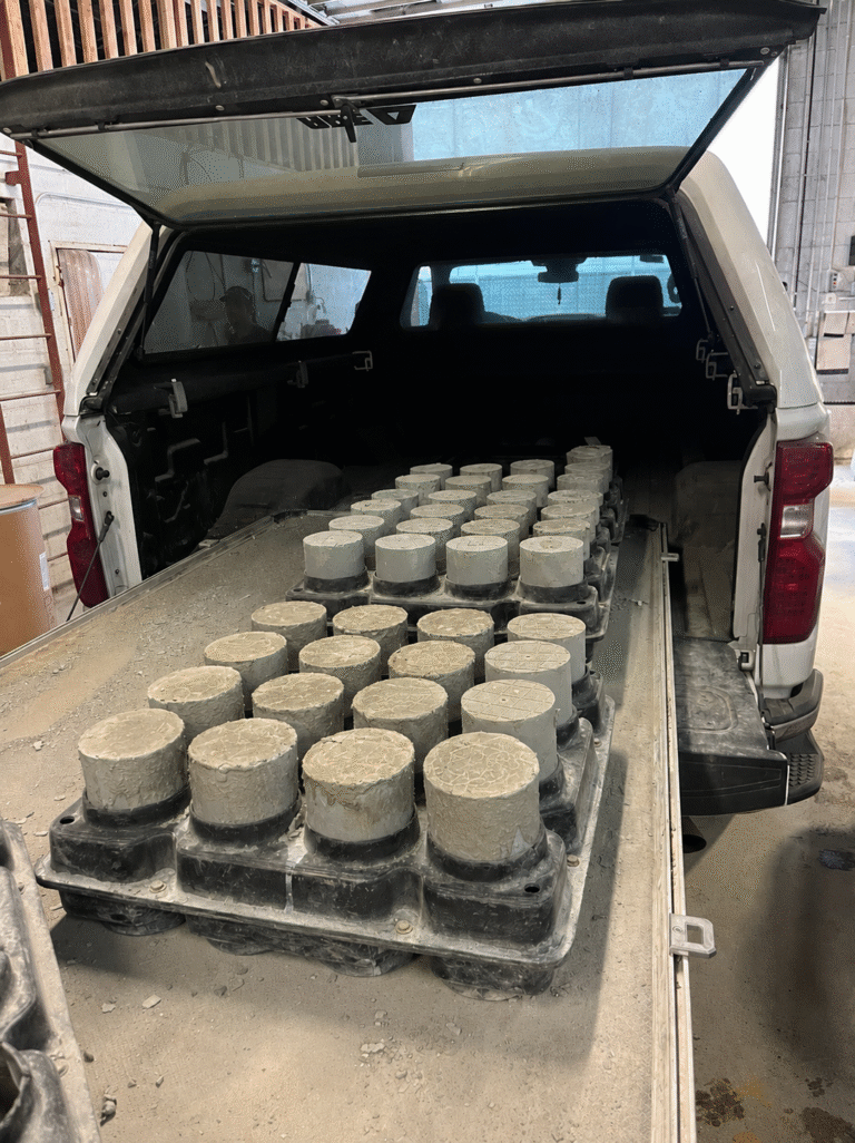 concrete cylinders being transported in a truck
